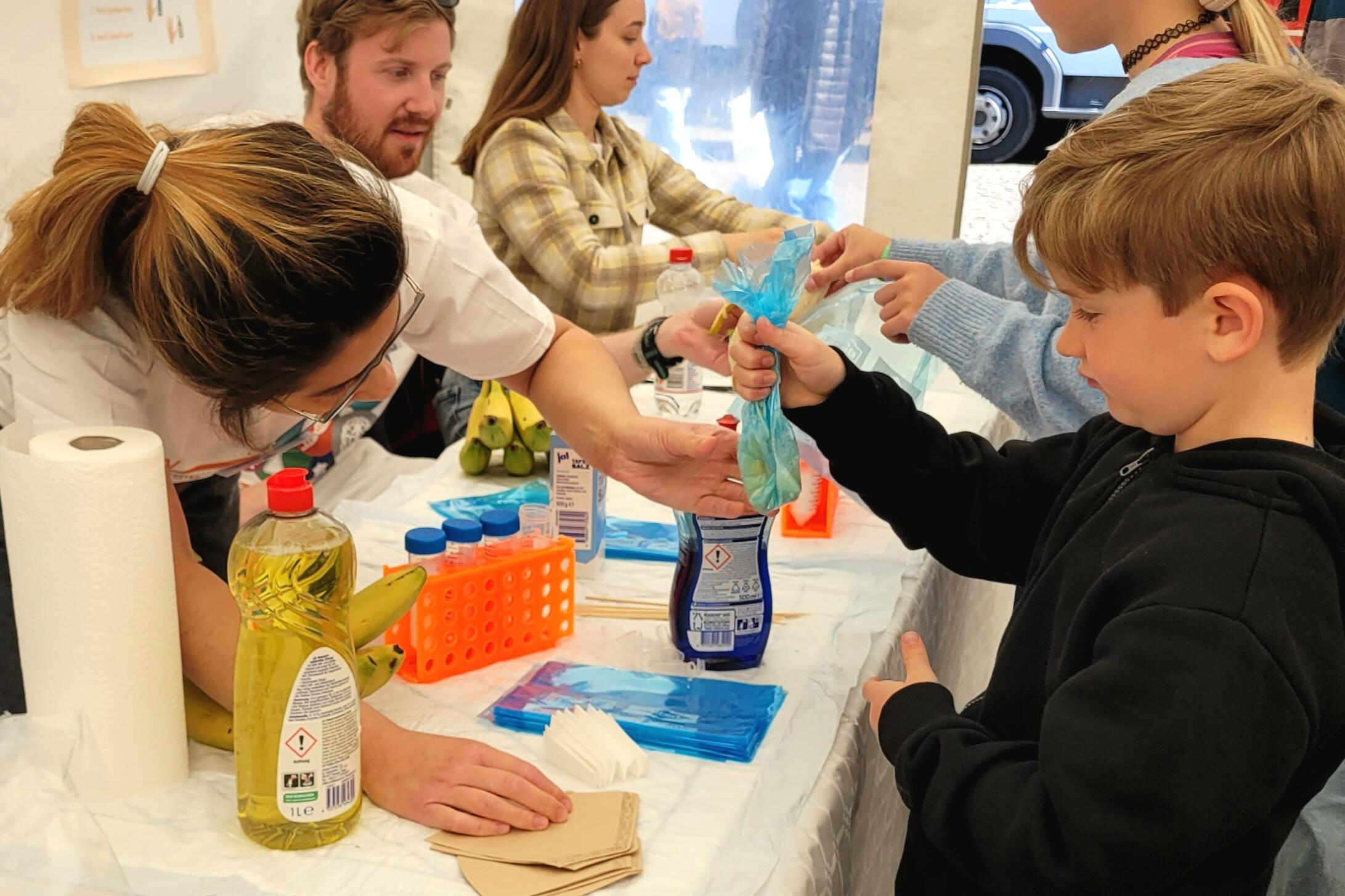 Boy prepping DNA at the Day of Immunology