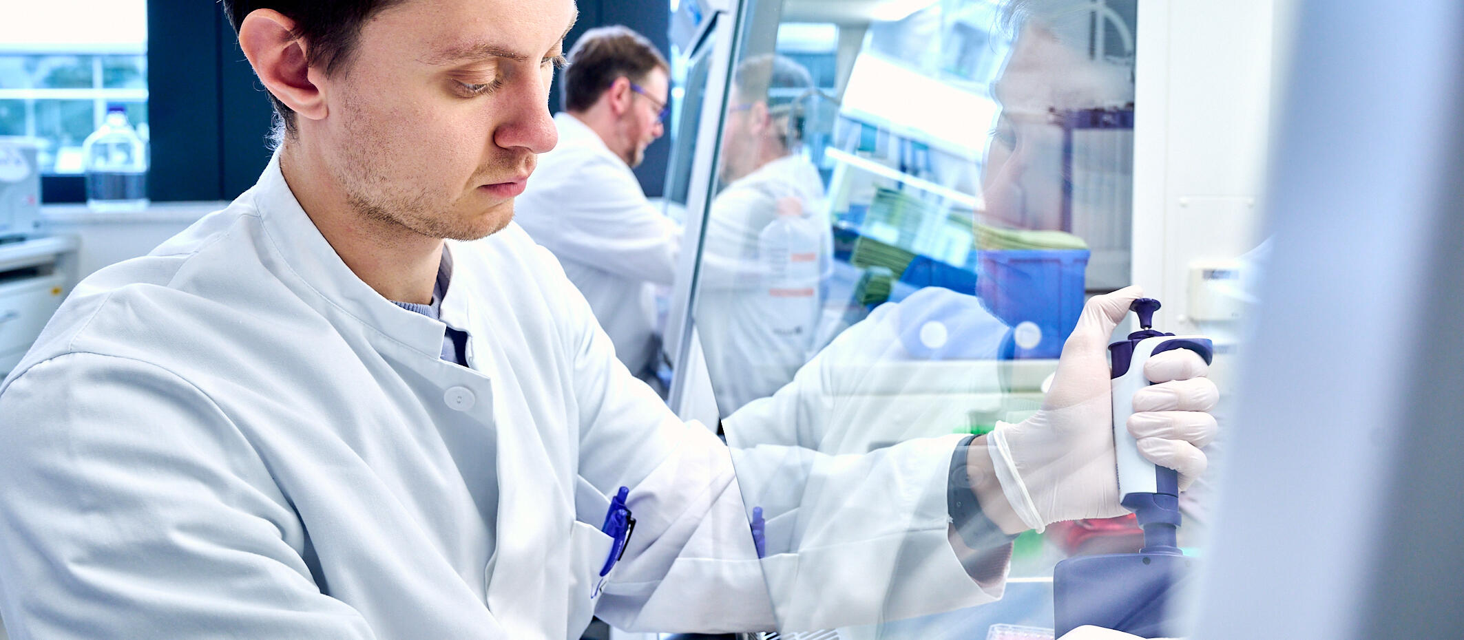 Scientist at sterile bench